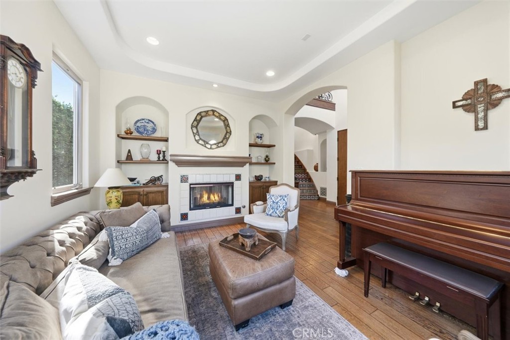 1740 Ruhland Avenue Manhattan Beach, CA 90266 - Photo 15 of 61 a living room with furniture a clock and a fireplace