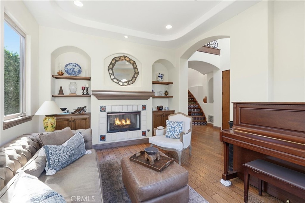1740 Ruhland Avenue Manhattan Beach, CA 90266 - Photo 16 of 61 a living room with furniture a fireplace and a large window