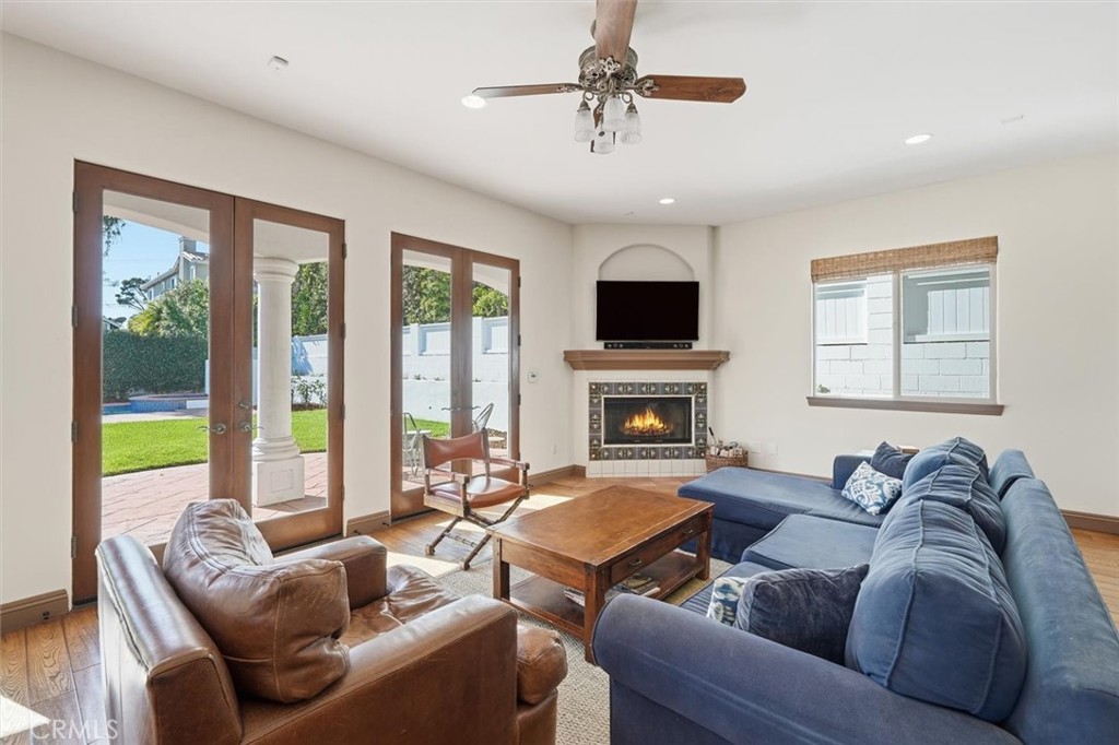 1740 Ruhland Avenue Manhattan Beach, CA 90266 - Photo 18 of 61 a living room with furniture a fireplace and a flat screen tv