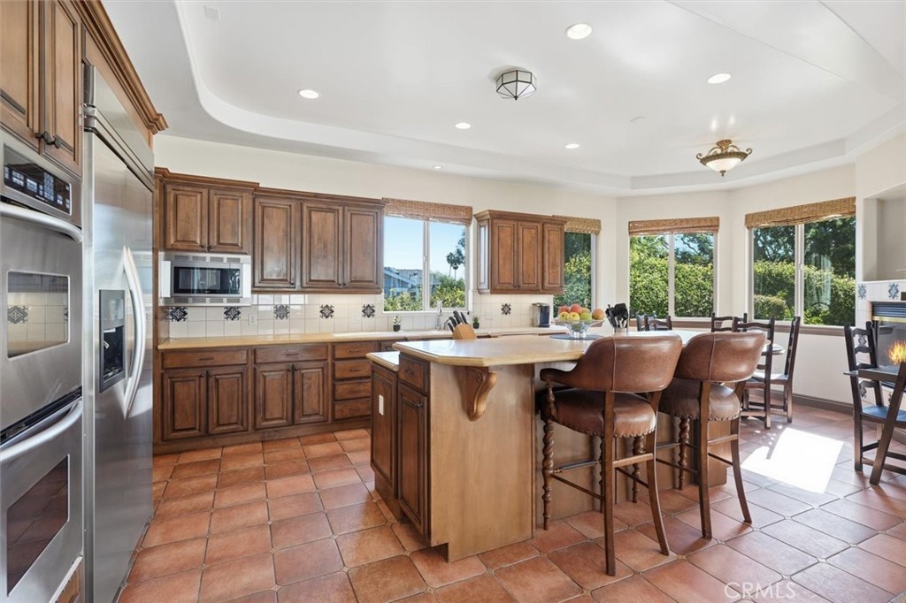 1740 Ruhland Avenue Manhattan Beach, CA 90266 - Photo 21 of 61 a kitchen with a sink window and cabinets