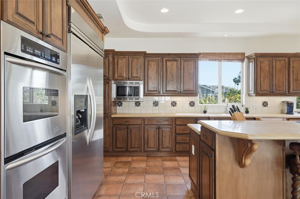 1740 Ruhland Avenue Manhattan Beach, CA 90266 - Photo 23 of 61 a kitchen with stainless steel appliances granite countertop a sink stove and refrigerator