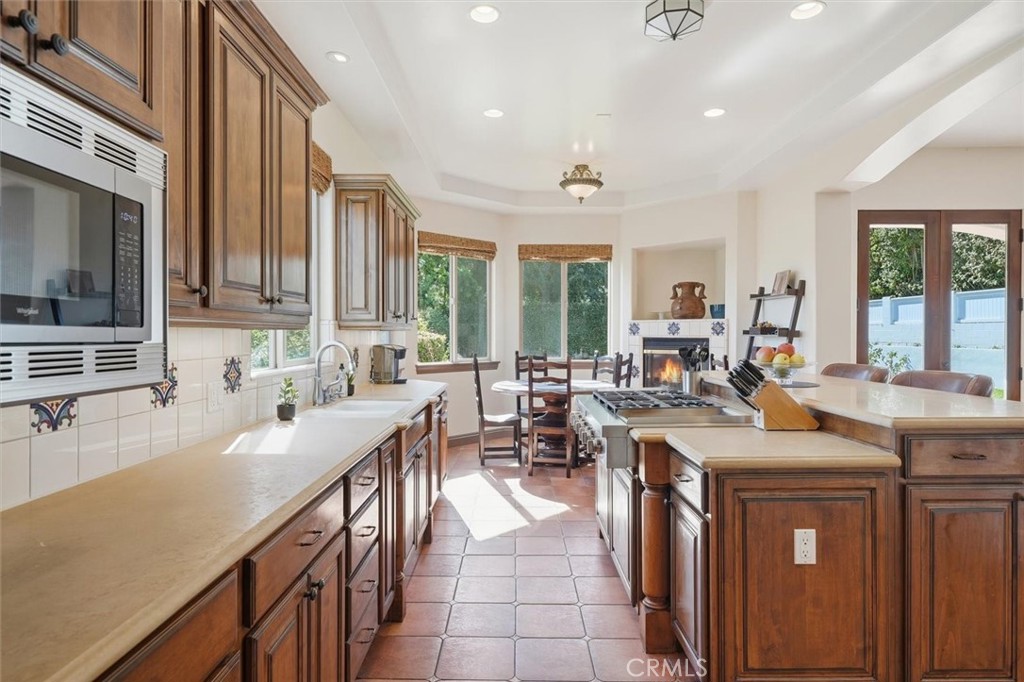 1740 Ruhland Avenue Manhattan Beach, CA 90266 - Photo 24 of 61 a open kitchen with stainless steel appliances granite countertop a sink a stove and a refrigerator