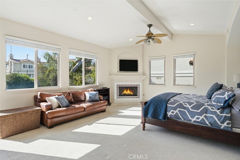 1740 Ruhland Avenue Manhattan Beach, CA 90266 - Photo 37 of 61 a living room with furniture a fireplace and a flat screen tv