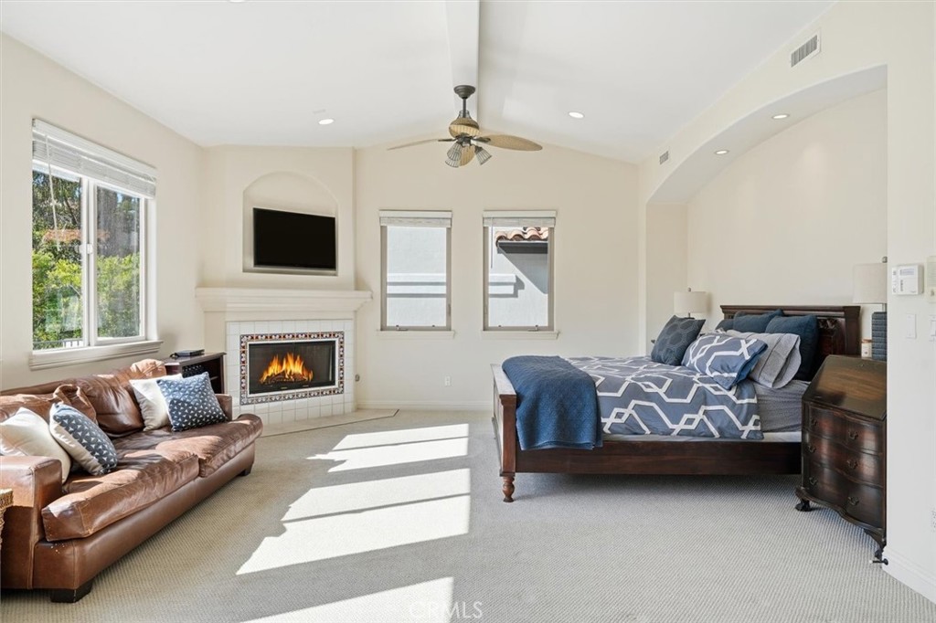 1740 Ruhland Avenue Manhattan Beach, CA 90266 - Photo 39 of 61 a spacious bedroom with a large bed couch and window