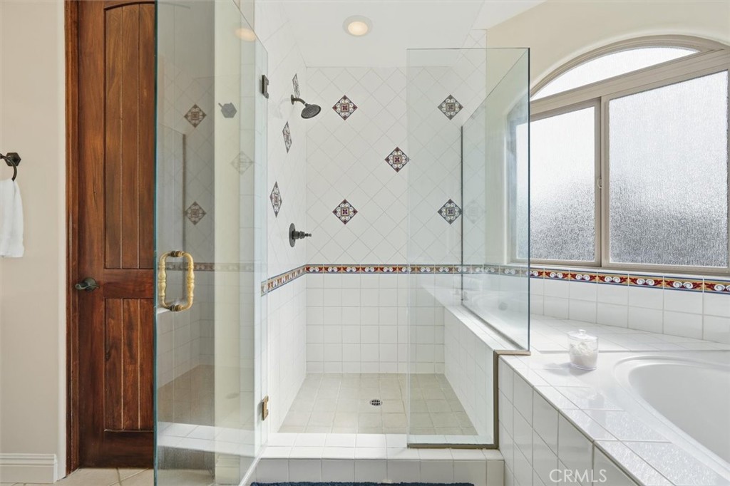 1740 Ruhland Avenue Manhattan Beach, CA 90266 - Photo 49 of 61 a bathroom with a granite countertop sink a mirror and shower