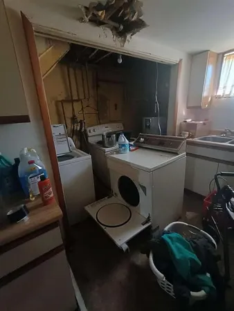a kitchen with a sink and a stove