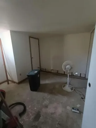 a room with furniture and a window