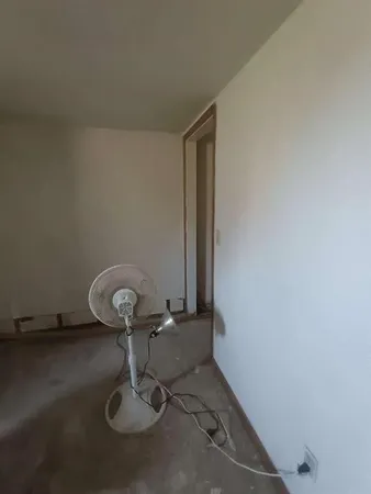 a room with furniture and a window