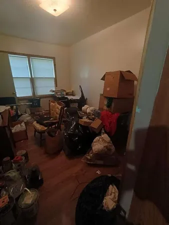 a view of hallway with furniture and a window