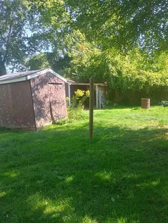 a view of a backyard with a garden