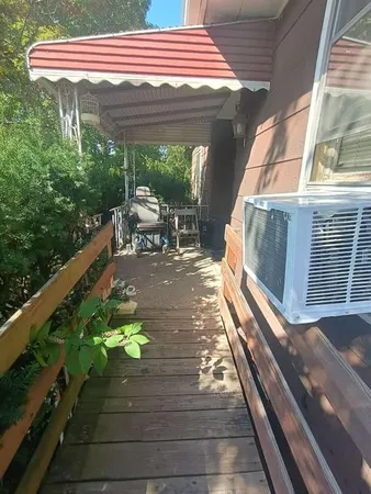 a balcony with view of outdoor space