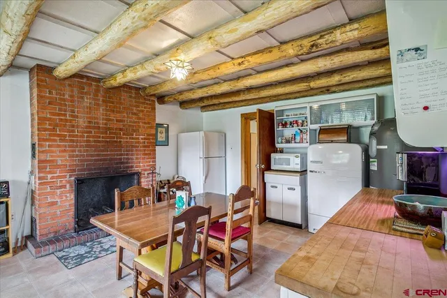 a living room with furniture and fireplace