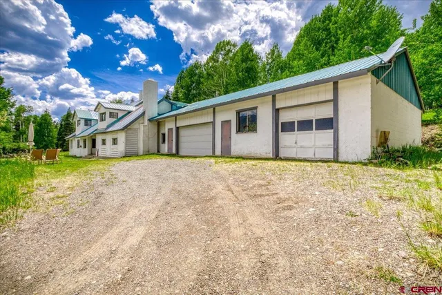 a house with trees in the background