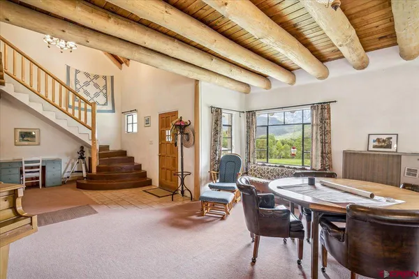 a view of a livingroom with furniture and window