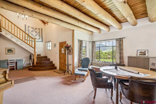 a view of a livingroom with furniture and window