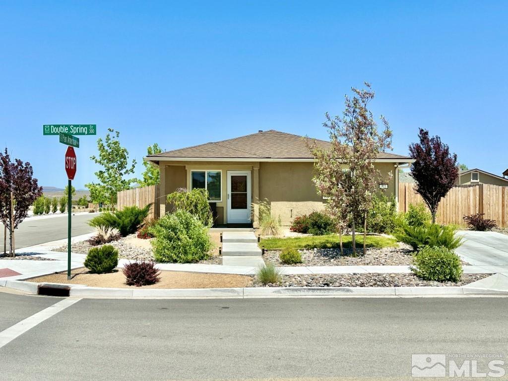 343 Double Spring Drive Reno, NV 89506 - Photo 1 of 27 a front view of a house with a yard