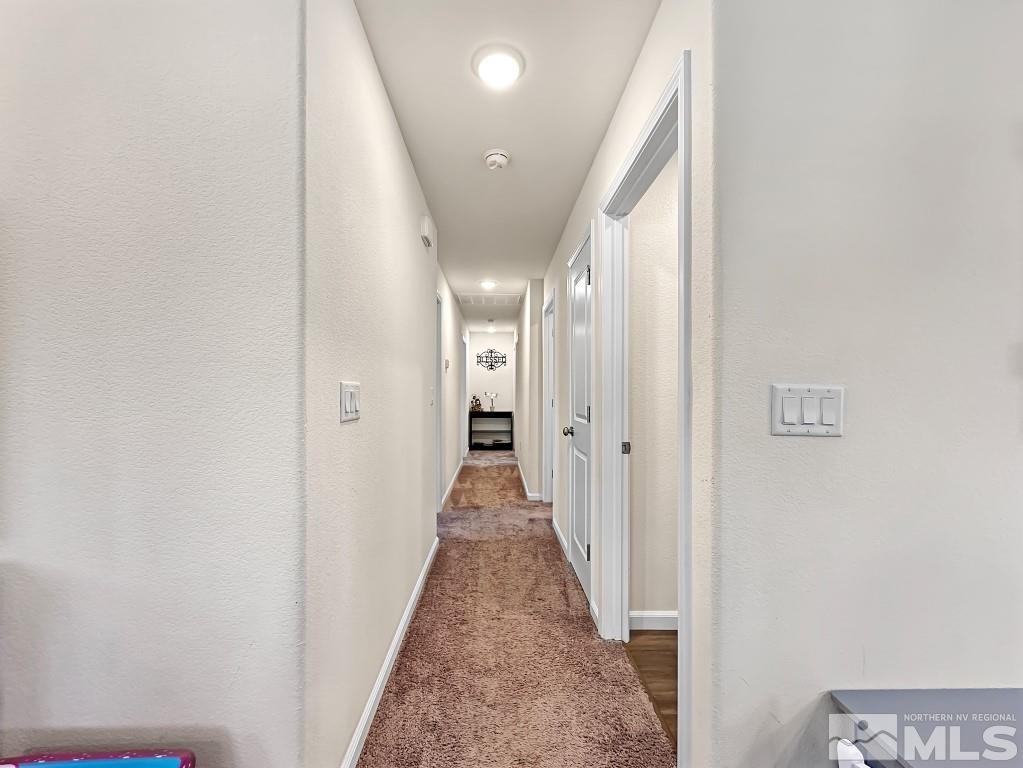 343 Double Spring Drive Reno, NV 89506 - Photo 14 of 27 a view of a hallway with a white walls