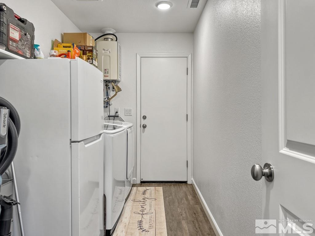 343 Double Spring Drive Reno, NV 89506 - Photo 15 of 27 a white refrigerator freezer and a stove sitting inside of a kitchen