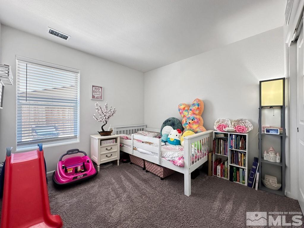 343 Double Spring Drive Reno, NV 89506 - Photo 21 of 27 a bedroom with furniture and a window