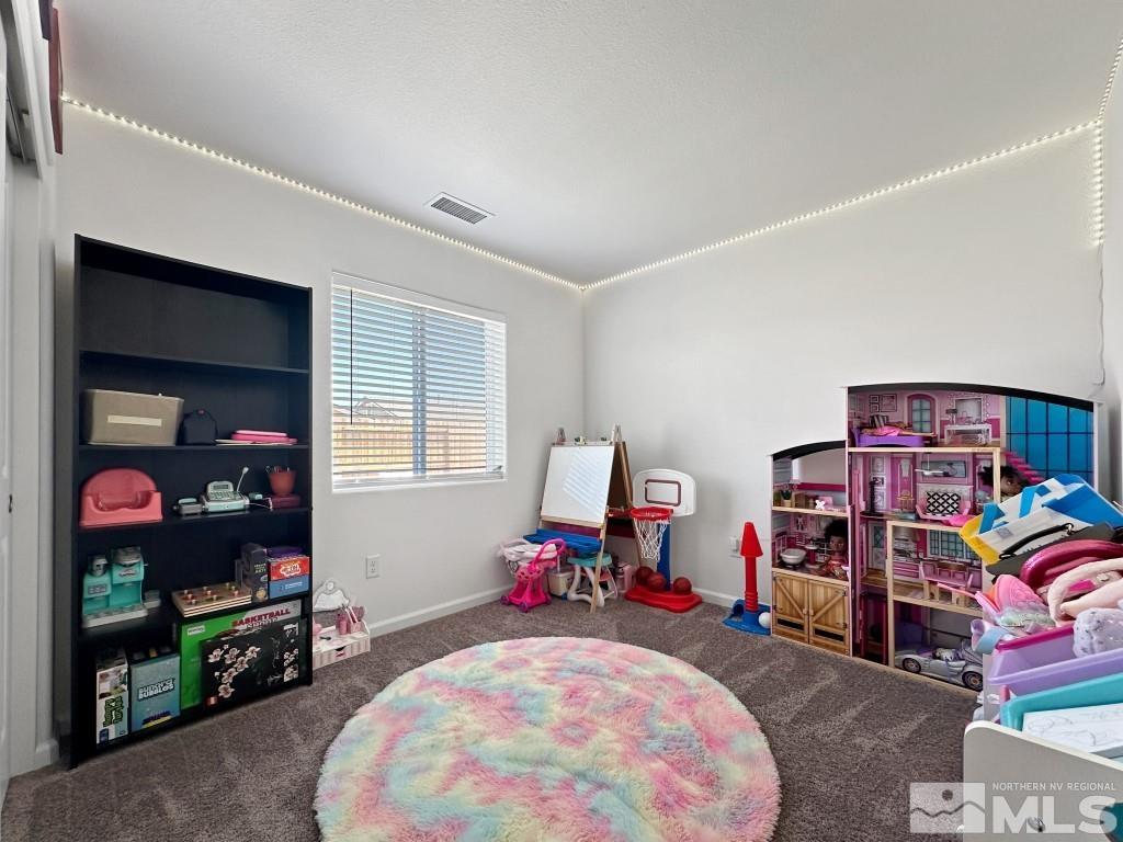 343 Double Spring Drive Reno, NV 89506 - Photo 22 of 27 a bed room with a bed and a tv