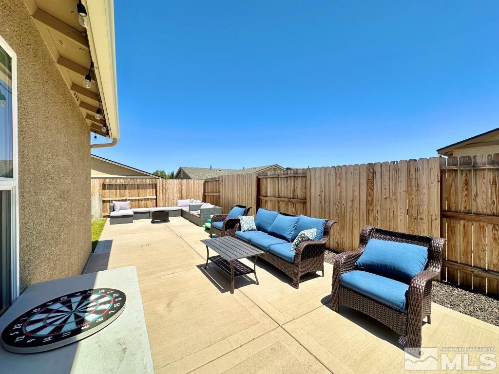343 Double Spring Drive Reno, NV 89506 - Photo 24 of 27 a view of a patio with couches and potted plants with sky view