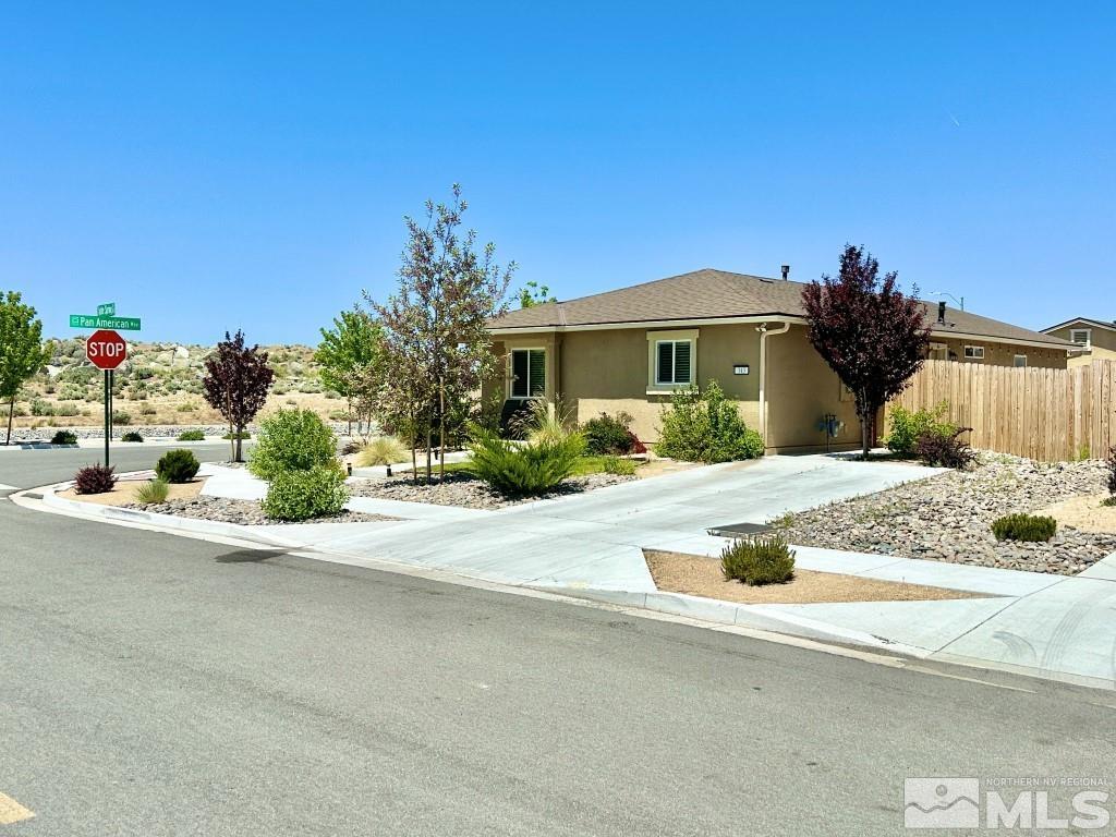 343 Double Spring Drive Reno, NV 89506 - Photo 3 of 27 a front view of a house with a yard