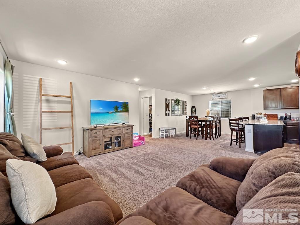 343 Double Spring Drive Reno, NV 89506 - Photo 5 of 27 a living room with furniture and a flat screen tv