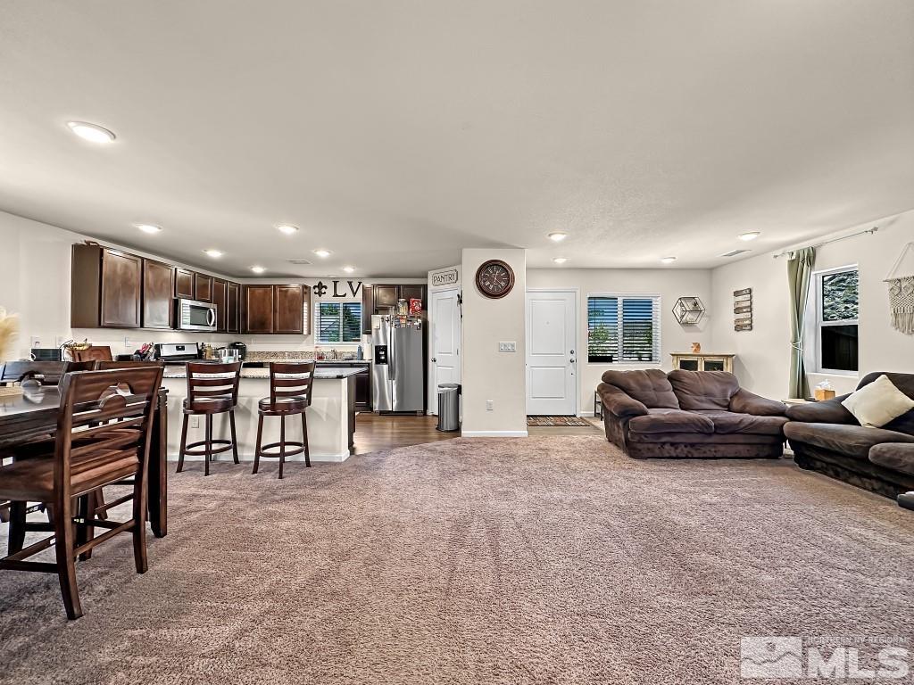 343 Double Spring Drive Reno, NV 89506 - Photo 8 of 27 a living room with lots of furniture and kitchen