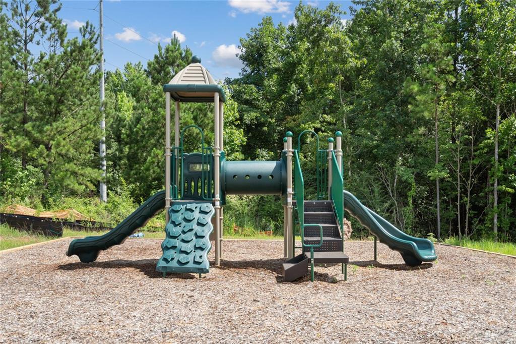 725 Sinclair Lane Temple, GA 30179 - Photo 36 of 36 a view of a deck with a trees and wooden fence