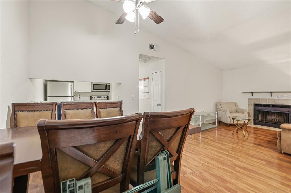 4004 Nestle Oaks Place, Unit 203 Tampa, FL 33613 - Photo 22 of 32 a dining room with furniture and wooden floor