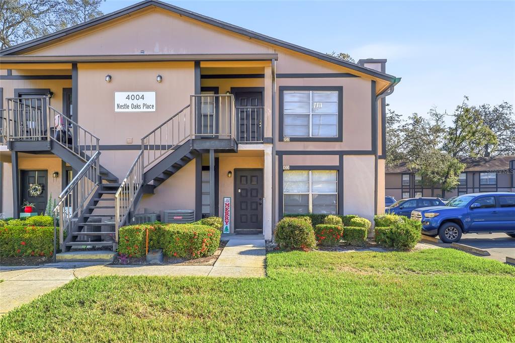 4004 Nestle Oaks Place, Unit 203 Tampa, FL 33613 - Photo 24 of 32 a front view of a house with garden