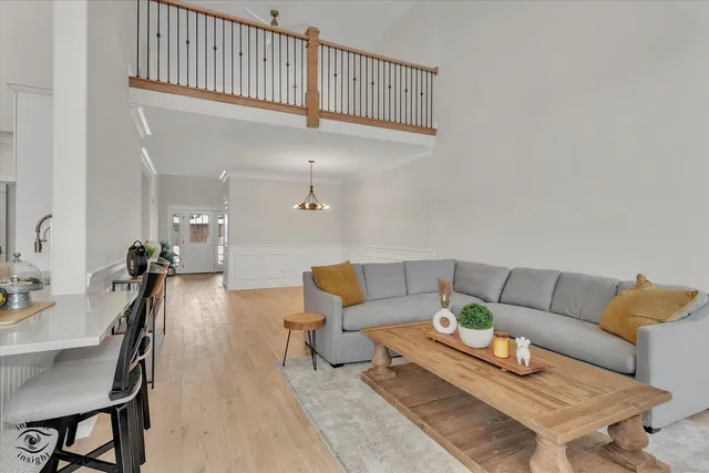 a living room with furniture and a rug