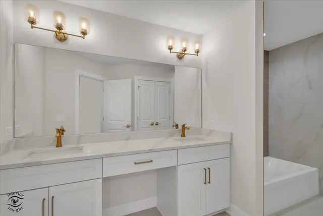 a bathroom with a sink a toilet and bathtub