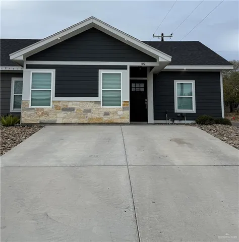 a front view of a house with garage