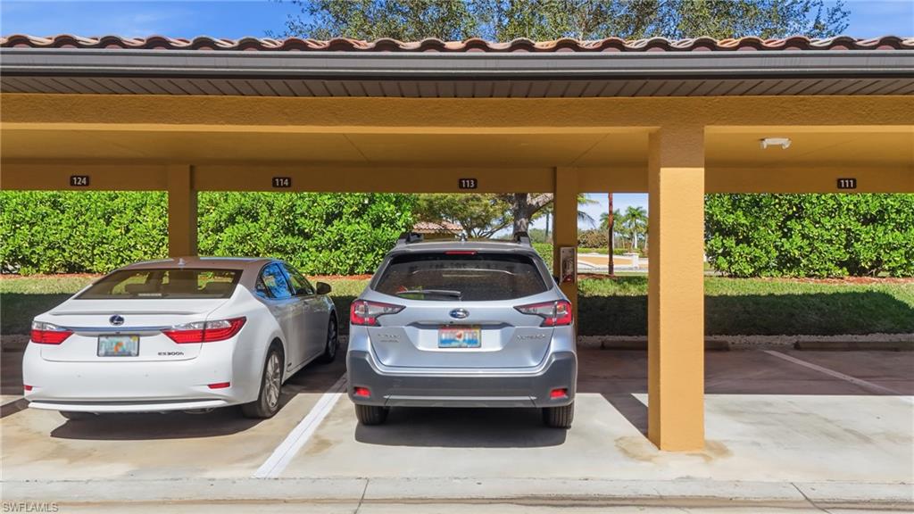 9715 Acqua Court, Unit 113 Naples, FL 34113 - Photo 24 of 31 View of covered parking lot