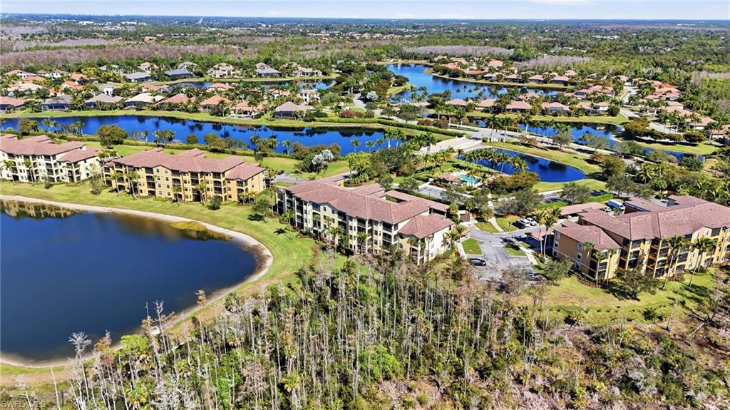 9715 Acqua Court, Unit 113 Naples, FL 34113 - Photo 26 of 31 Bird's eye view of a large body of water