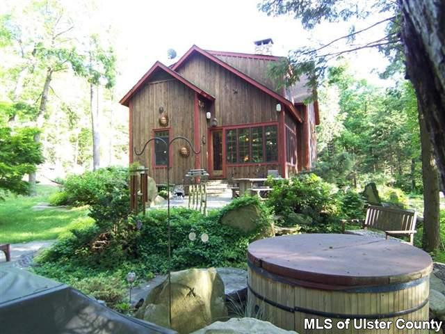 428 North Riverside Road Highland, NY 12528 - Photo 3 of 17 a view of a house with fountain and plants
