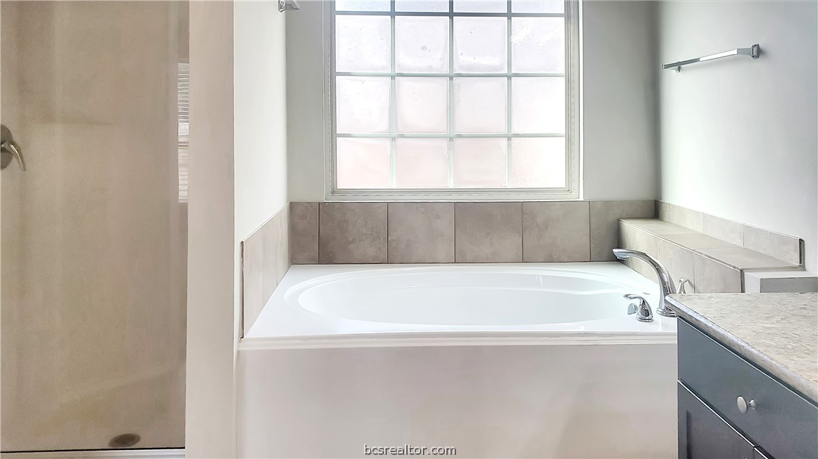 3741 Mariposa Court Bryan, TX 77808 - Photo 11 of 11 a white bath tub sitting next to a window