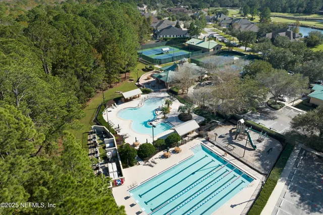 a view of a swimming pool with an outdoor seating