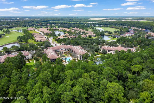 a bedroom with a bed and a chair