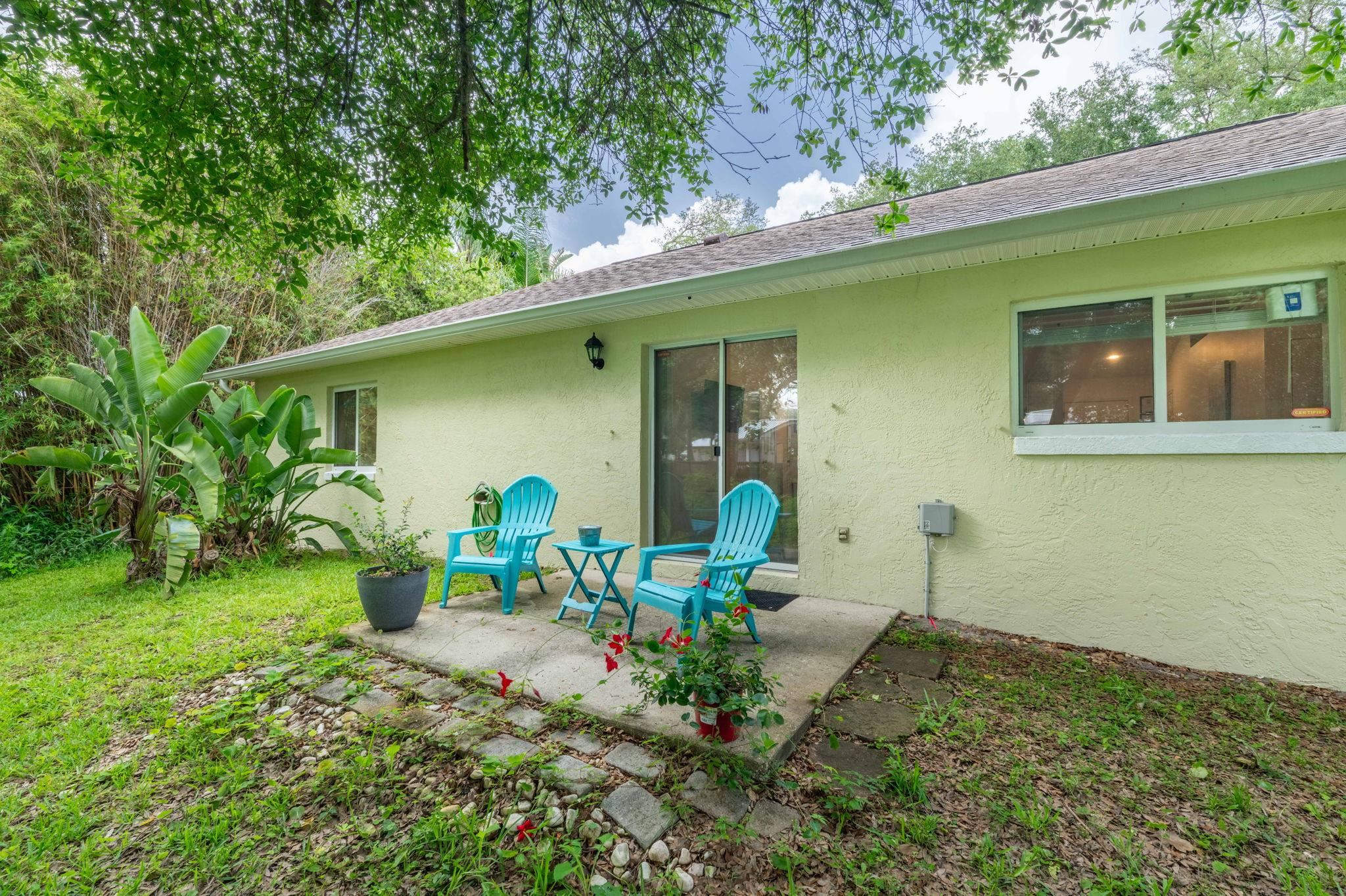 110 Dory Road St. Augustine, FL 32086 - Photo 31 of 35 a backyard of a house with table and chairs