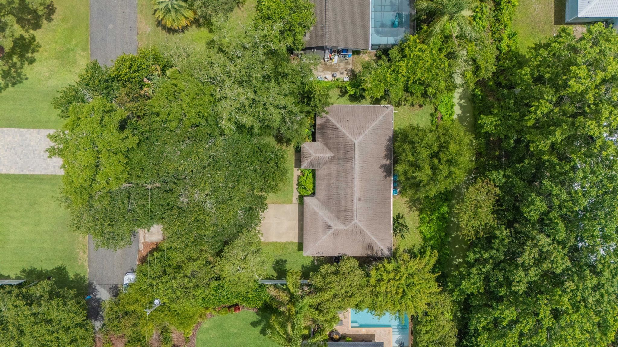 110 Dory Road St. Augustine, FL 32086 - Photo 32 of 35 an aerial view of a house with a yard and trees all around