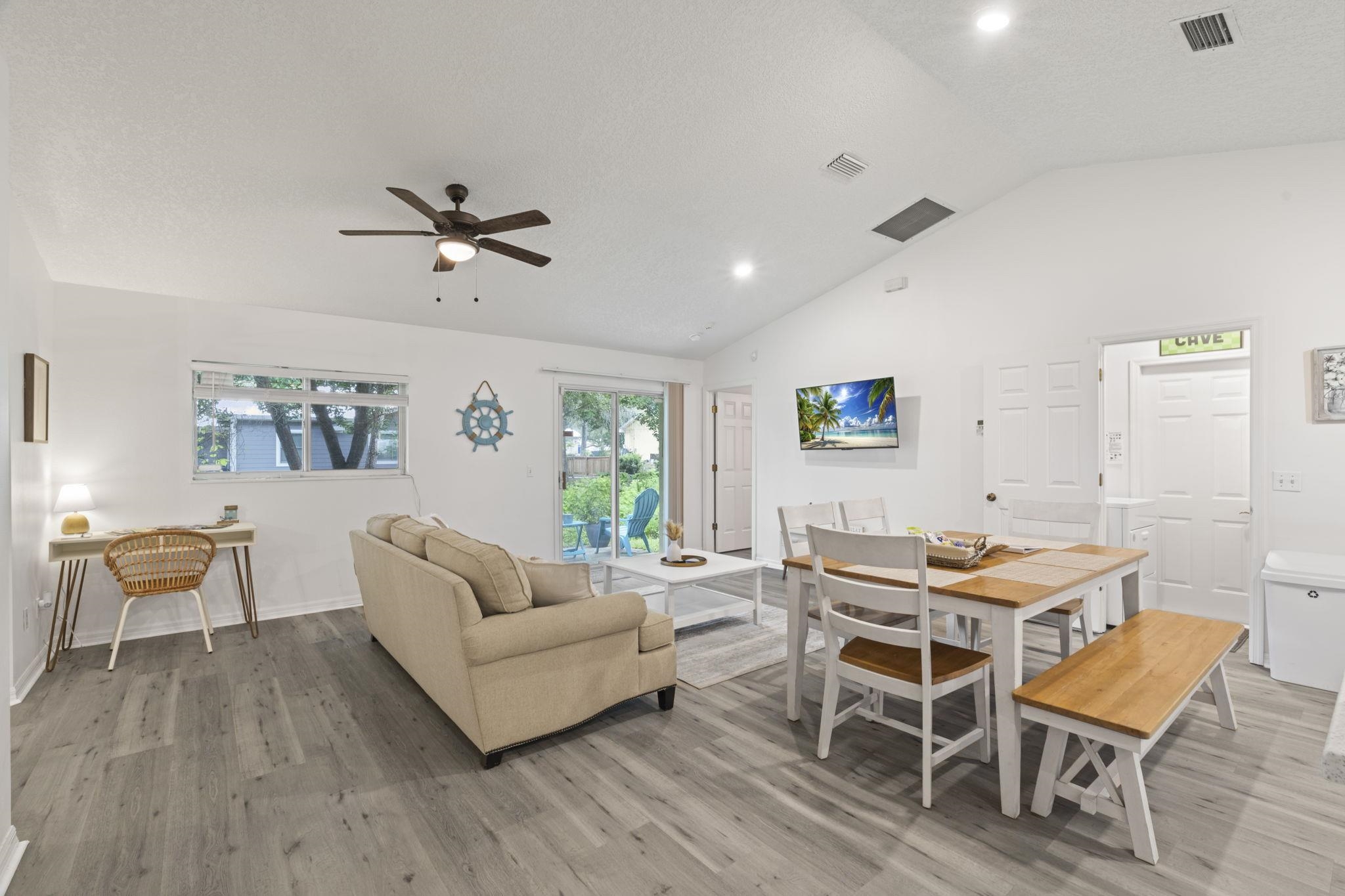 110 Dory Road St. Augustine, FL 32086 - Photo 5 of 35 a living room with furniture a dining table and a potted plant