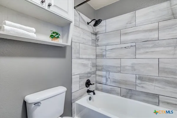 a bathroom with a sink and toilet