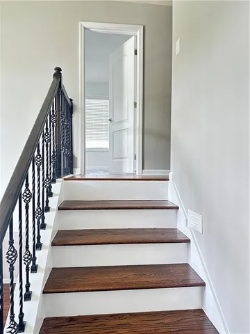 a view of staircase with white walls