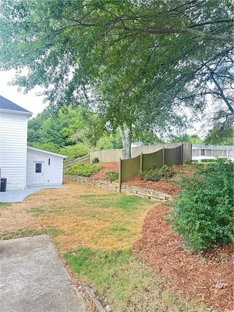a backyard of a house with a patio and a yard