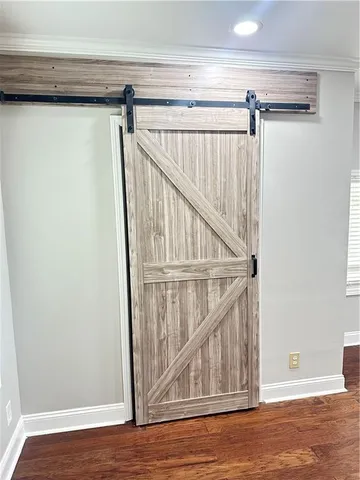 a view of a room with stairs and a wooden floor