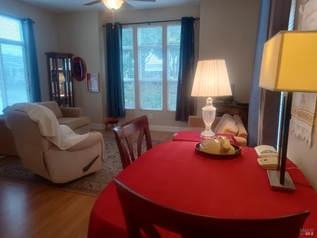 a bathroom with a granite countertop sink a toilet and a large mirror