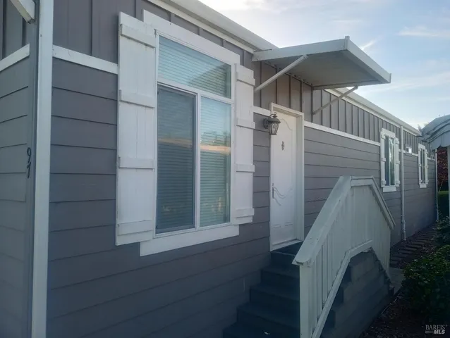 a kitchen with stainless steel appliances granite countertop a refrigerator stove a microwave and cabinets