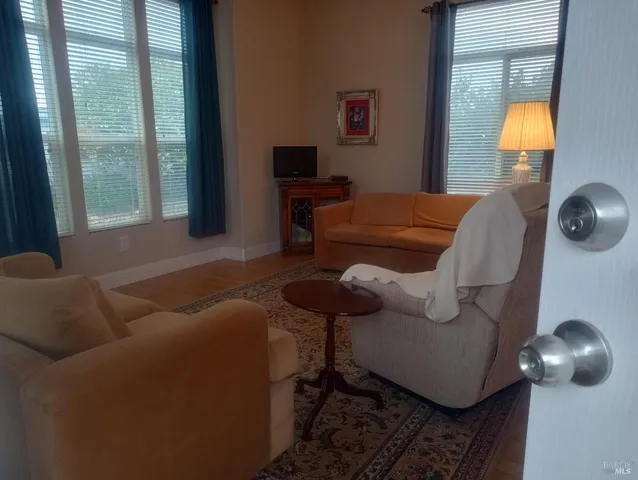 a kitchen with granite countertop cabinets and white appliances